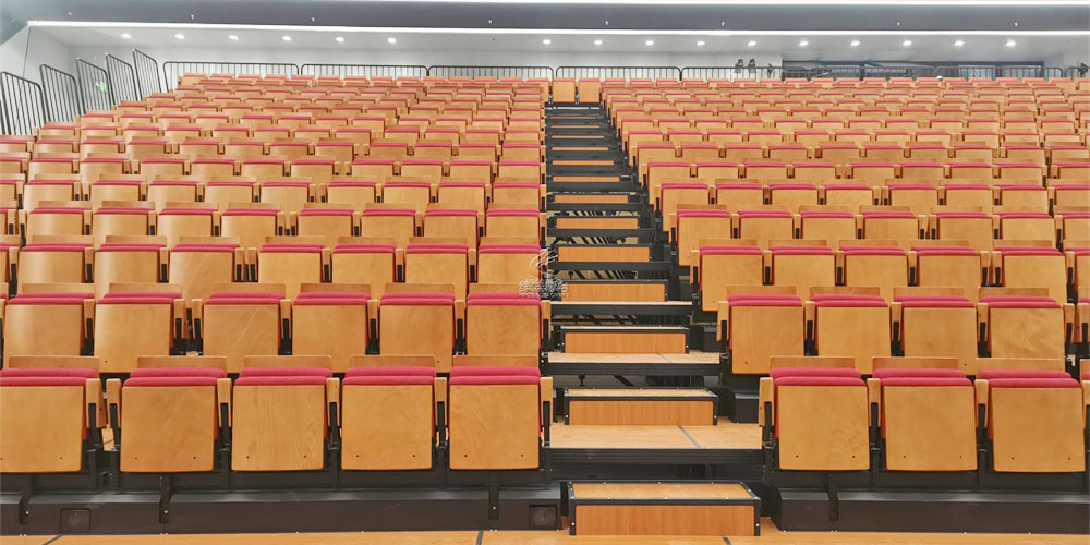 伸縮看臺(tái)座椅的“機(jī)械骨骼”：驅(qū)動(dòng)系統(tǒng)、軌道材質(zhì)與安全保障全解析